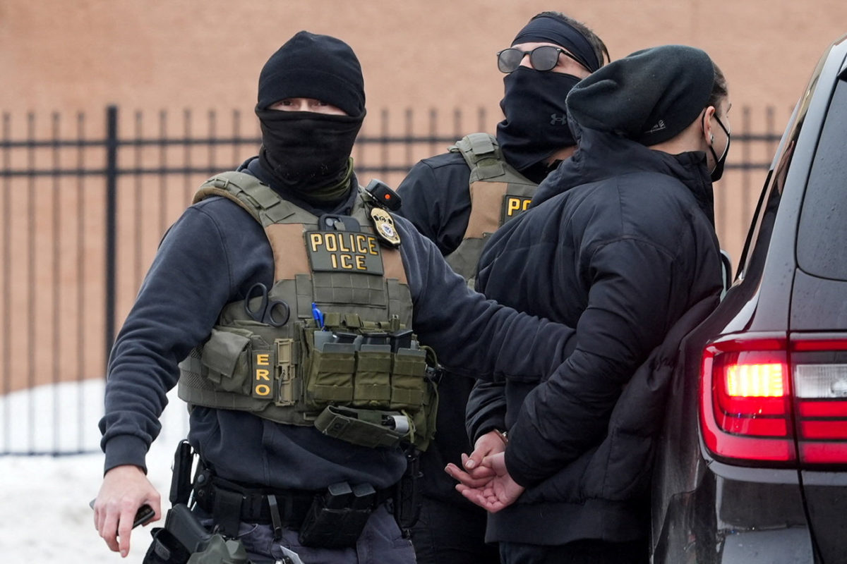 Members of U.S. Immigration and Customs Enforcement (ICE) detain an observer, who was later released, as part of U.S. President Donald's Trump's immigraton policy, in Minneapolis, Minnesota, U.S., January 6, 2026.  REUTERS/Tim Evans